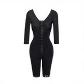 Black bodycon dress with lace-up front on a white background